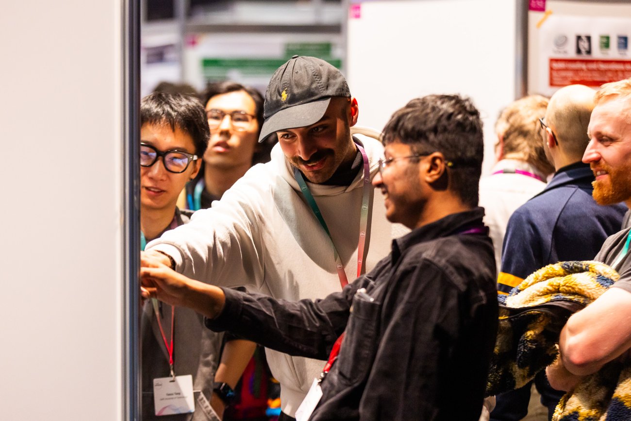 Visitors pointing at poster